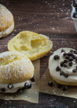 These cream puffs are sweet, tender, stuffed with an irresistible cannoli cream filling and topped with just a sprinkle of powdered sugar. Enjoy this traditional French pastry with an Italian twist, or fill it with whatever sweet treat you're craving. You won't believe how deceptively easy they are to make, and your guests won't be able to tell they're gluten free!