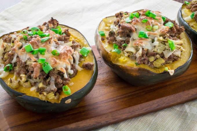 Sweet, nutty acorn squash stuffed with a savory homemade turkey sausage, onions and gooey mozzarella cheese and baked to perfection. You won't believe how simply easy these are to make, and they look so fancy! Serve this satisfying Acorn Squash Stuffed with Turkey Sausage as a side dish during the holidays or as the main course!