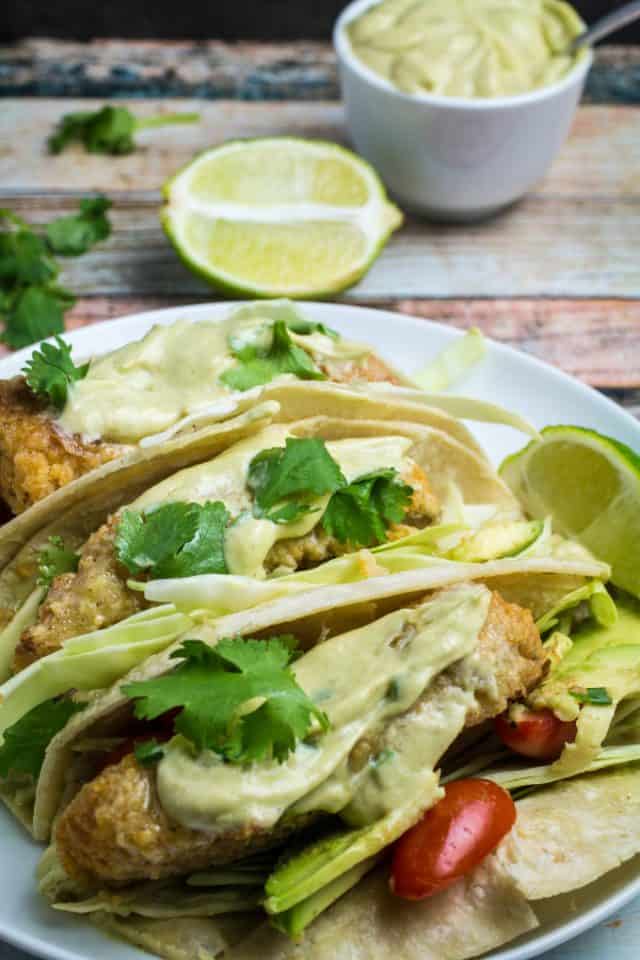 Oven Fried Fish Tacos with Spicy Avocado Cream Sauce