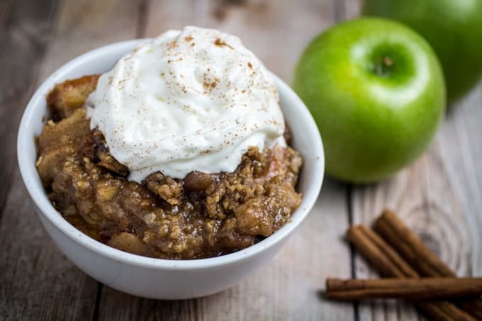 Sweet apples topped with crumbly, buttery oats and slow cooked with cinnamon and brown sugar. Serve warm and top with vanilla ice cream. This Slow Cooker Apple Crisp recipe is so incredibly easy to make, you'll never want to make it in the oven again!