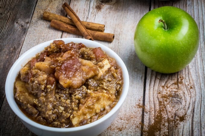 Sweet apples topped with crumbly, buttery oats and slow cooked with cinnamon and brown sugar. Serve warm and top with vanilla ice cream. This Slow Cooker Apple Crisp recipe is so incredibly easy to make, you'll never want to make it in the oven again!