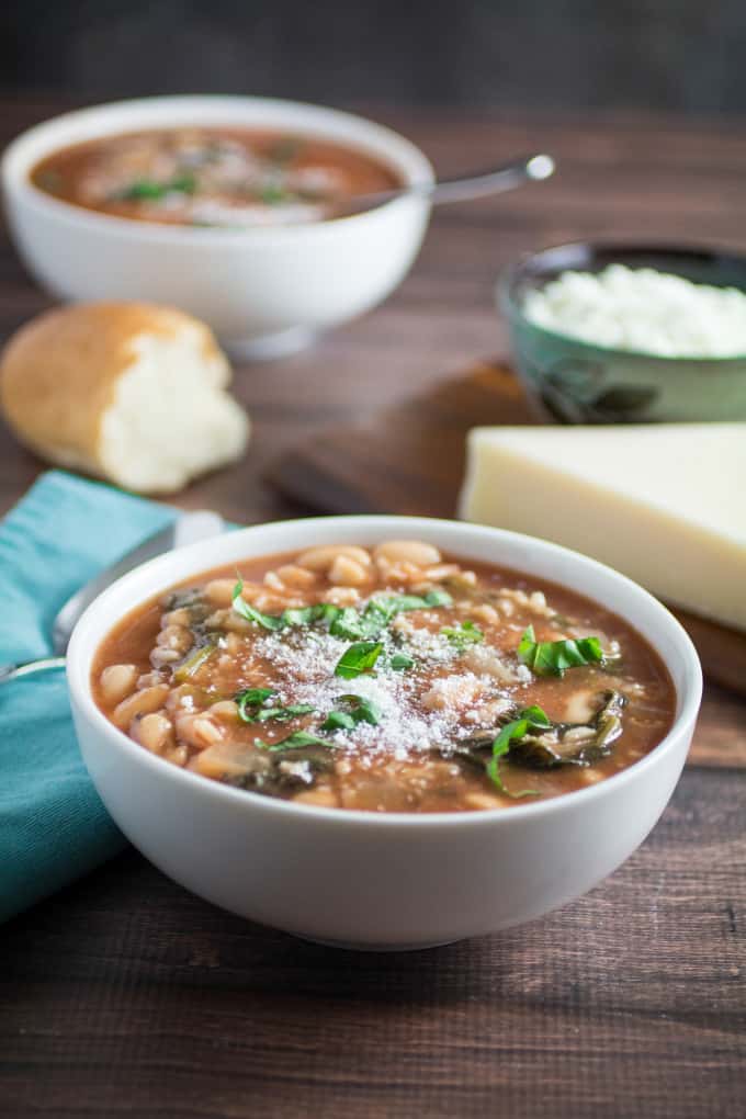 Hearty, savory, and satisfying, this easy Slow Cooker Kale and White Bean Soup is the perfect no-fuss meal on a chilly autumn night. Italian flavors of garlic, basil, and thyme come together in slow cooker perfection, leaving you with a nutritious meal that feeds both your body and your soul. Top with parmesan and enjoy a meal that's so easy to make and ready when you are! 