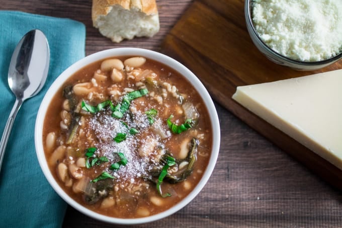 Hearty, savory, and satisfying, this easy Slow Cooker Kale and White Bean Soup is the perfect no-fuss meal on a chilly autumn night. Italian flavors of garlic, basil, and thyme come together in slow cooker perfection, leaving you with a nutritious meal that feeds both your body and your soul. Top with parmesan and enjoy a meal that's so easy to make and ready when you are! 