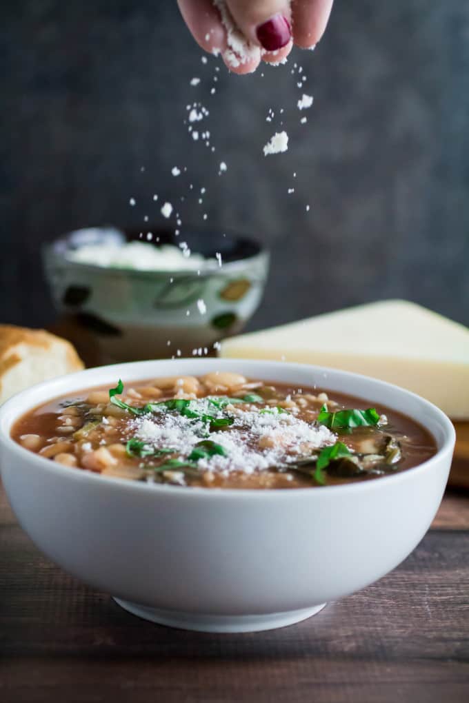 Hearty, savory, and satisfying, this easy Slow Cooker Kale and White Bean Soup is the perfect no-fuss meal on a chilly autumn night. Italian flavors of garlic, basil, and thyme come together in slow cooker perfection, leaving you with a nutritious meal that feeds both your body and your soul. Top with parmesan and enjoy a meal that's so easy to make and ready when you are! 