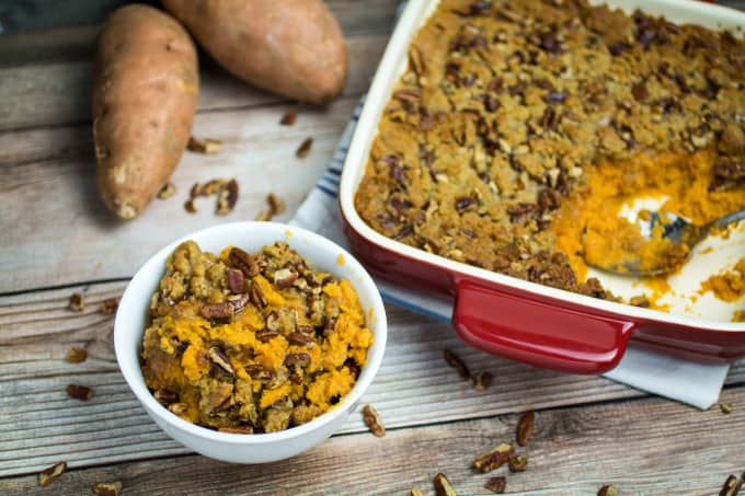 This traditional Thanksgiving casserole recipe uses baked sweet potatoes mashed together with brown sugar and autumn spices, then topped with a sweet and crunchy layer of crumble and pecans. A touch of maple syrup brings the rich, buttery taste of this Easy Sweet Potato Casserole with Pecan Crumble Topping to the next level! This really is the perfect side dish for your holiday table.