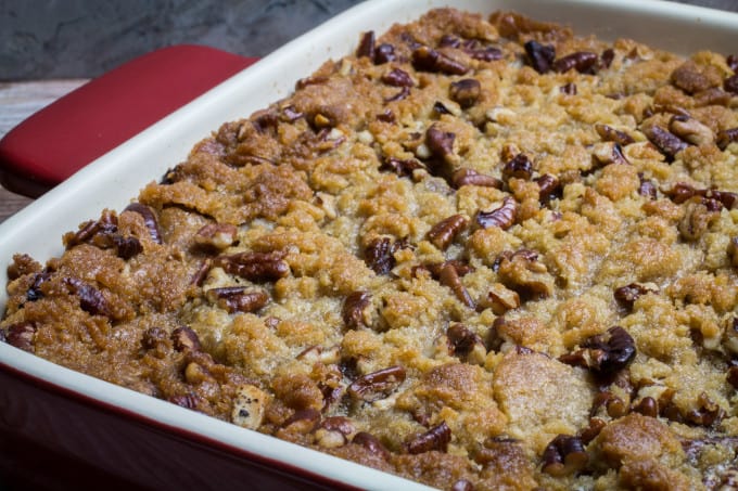 This traditional Thanksgiving casserole recipe uses baked sweet potatoes mashed together with brown sugar and autumn spices, then topped with a sweet and crunchy layer of crumble and pecans. A touch of maple syrup brings the rich, buttery taste of this Easy Sweet Potato Casserole with Pecan Crumble Topping to the next level! This really is the perfect side dish for your holiday table.