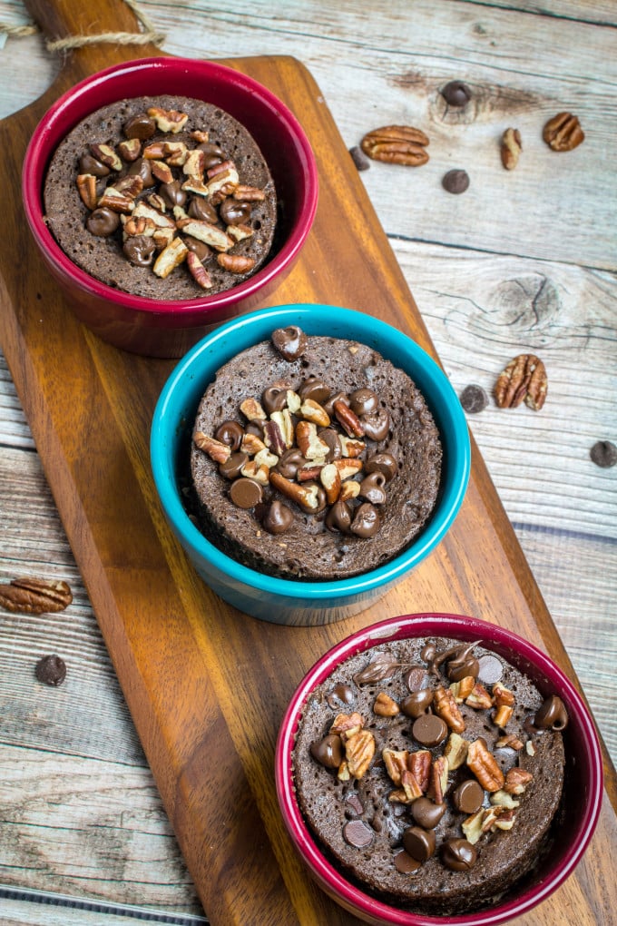 Rich chocolate cake made in less than 2 minutes! This Gluten Free Chocolate Mug Cake is bursting with smooth chocolate chips and crunchy pecans. So easy to make, this chocolate mug cake is made in your favorite coffee mug or small baking dish, and only takes a minute and a half in the microwave before it's finished. Gluten free baking has never been easier!