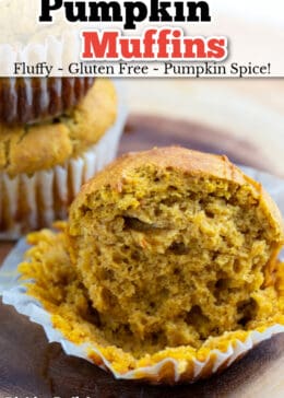 Pumpkin muffin sitting in a muffin liner cut in half.