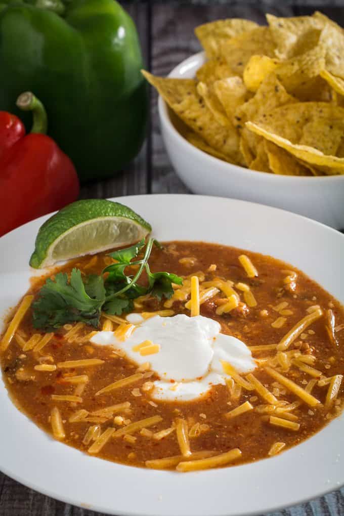 Slow Cooker Chicken Enchilada Soup • Dishing Delish