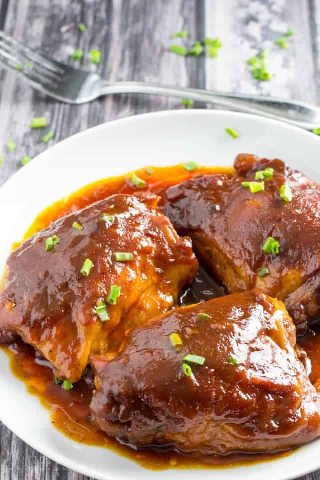 BEST Crockpot BBQ Chicken Thighs Ever • Dishing Delish