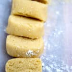 Almond paste on a cutting board cut into slices