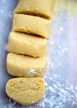 Almond paste on a cutting board cut into slices