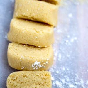 Almond paste on a cutting board cut into slices