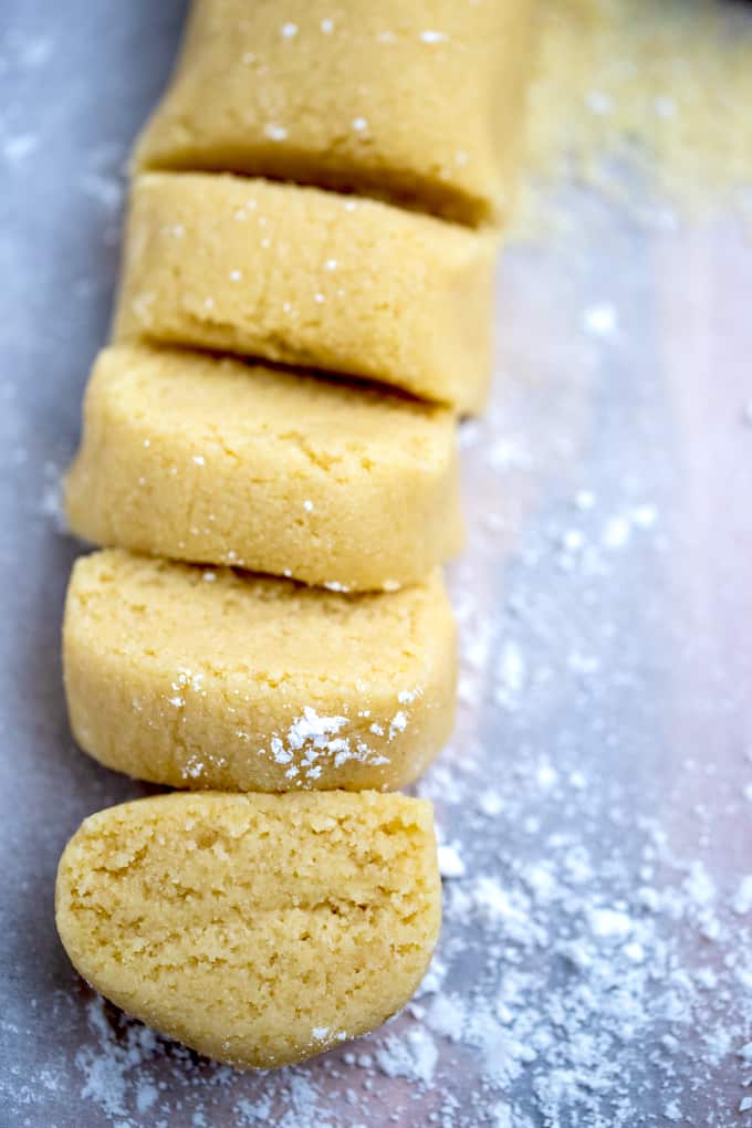 Almond paste on a cutting board cut into slices