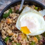 country quinoa bowl closeup with over easy egg on top
