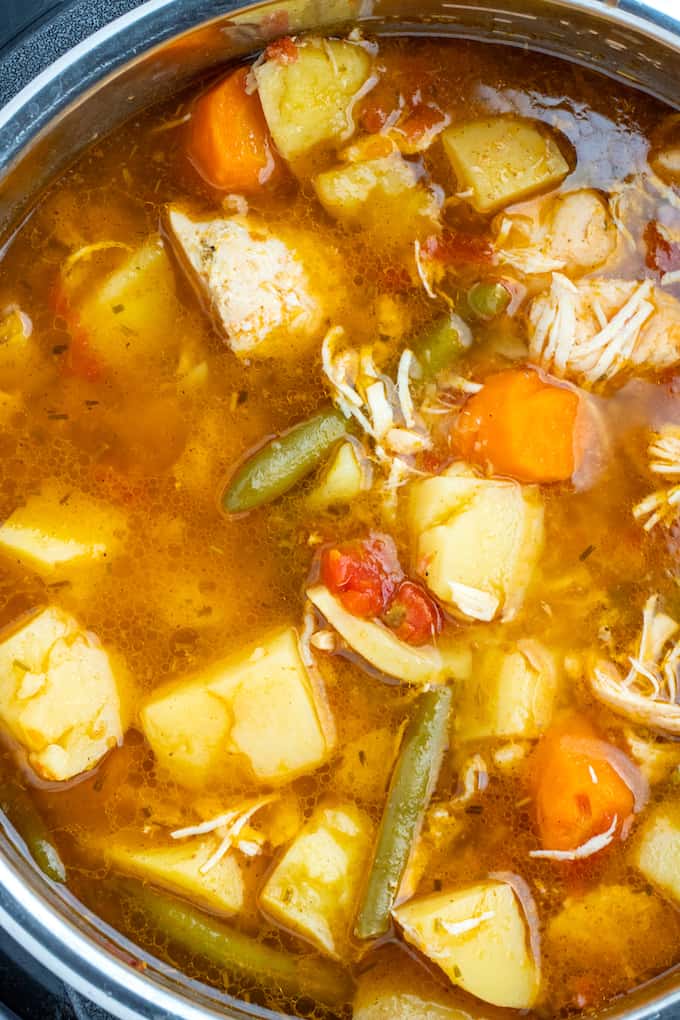 Top down photo of chicken stew inside of the instant pot pot. 