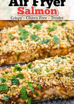 Pinterest pin for air fryer salmon with salmon sitting on an air fryer shelf with crispy breadcrumb topping.