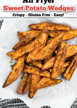 Air fryer sweet potato wedges on top of parchment paper.