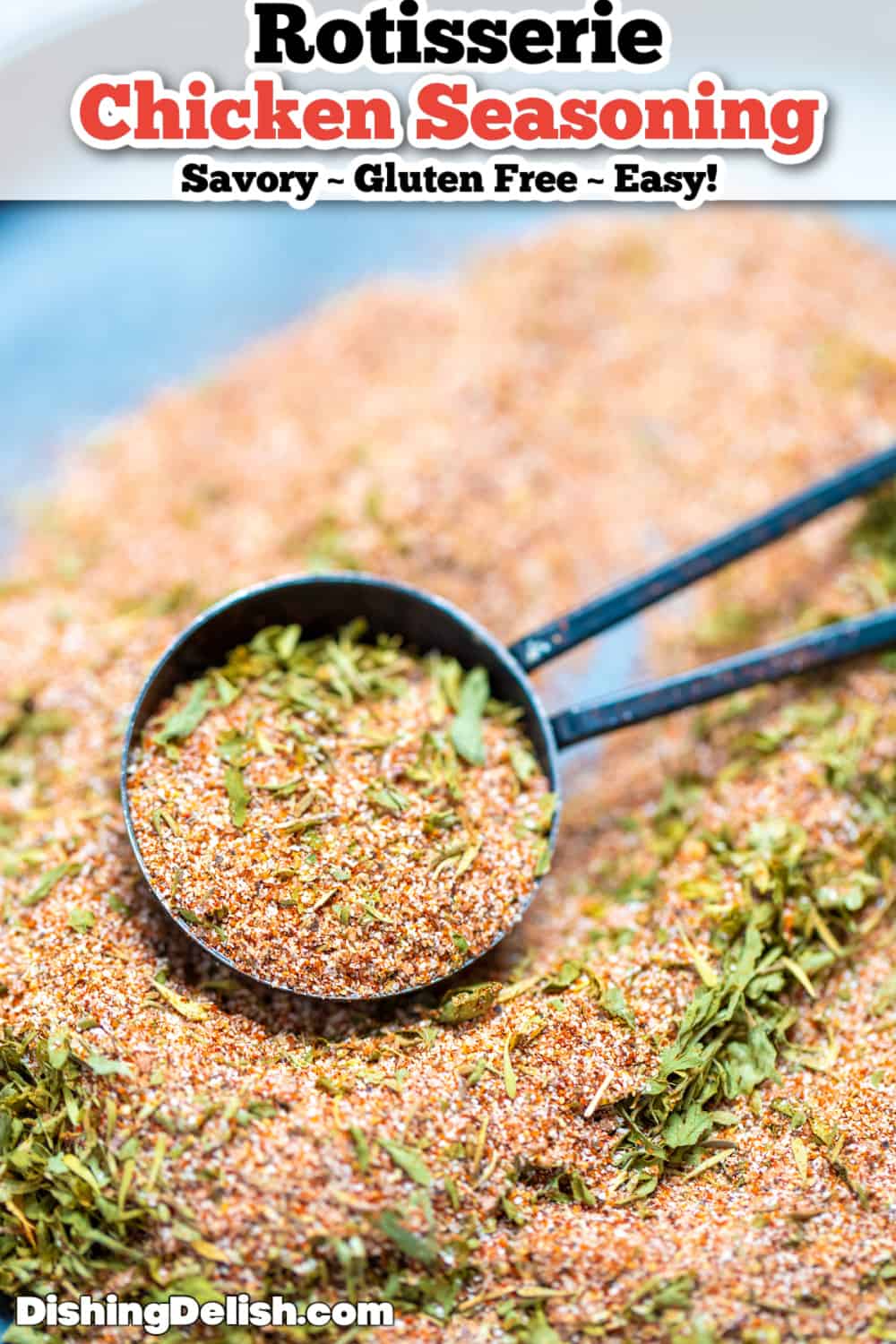 Pinterest pin for Rotisserie Chicken Seasoning with a tablespoon scooping up the spices.