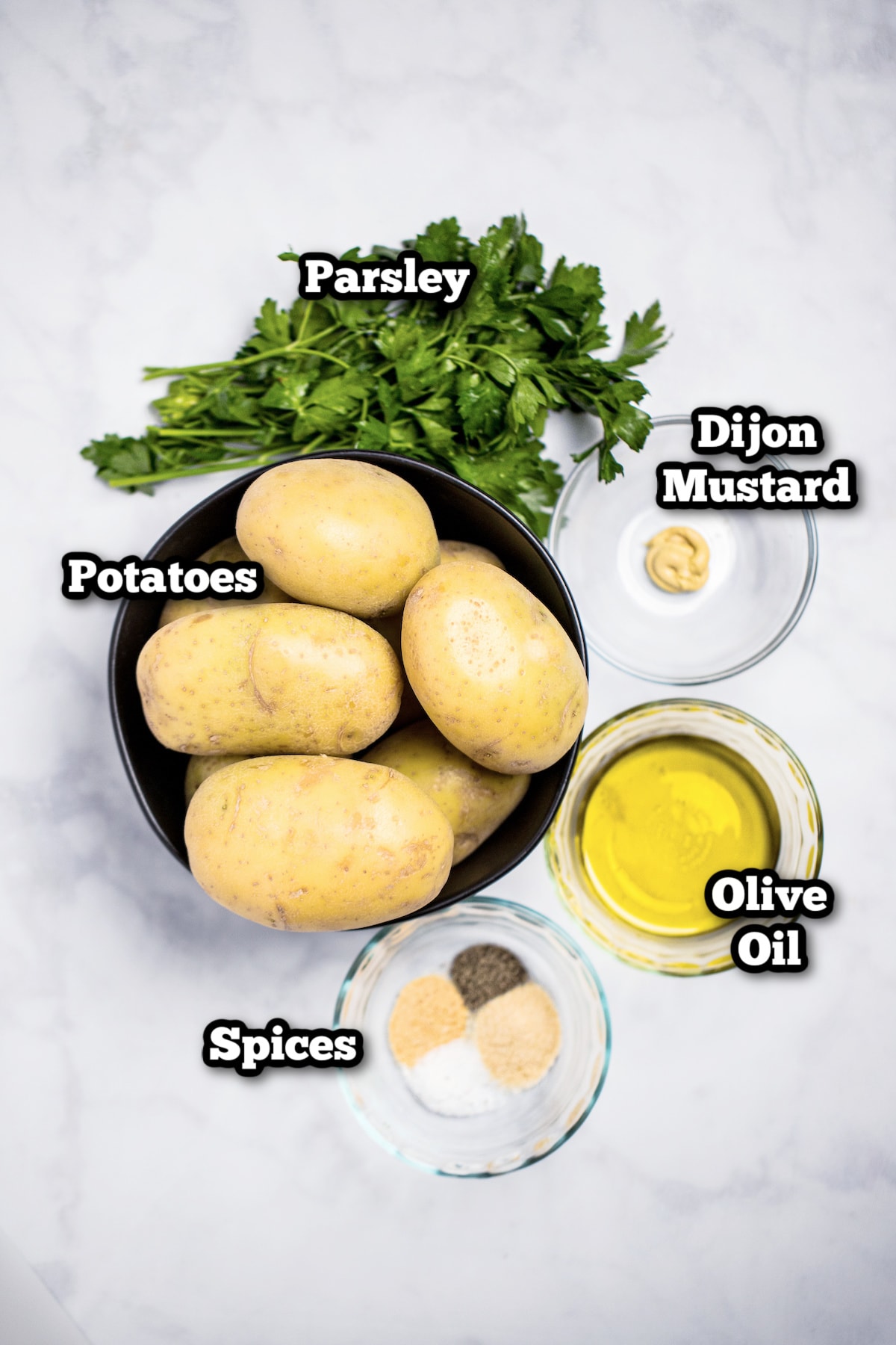 Individual ingredients for slow cooker potatoes on a table.