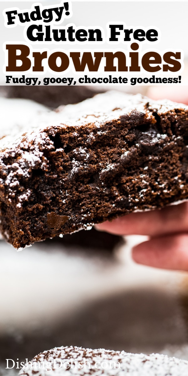 Pinterest pin with a photo of a hand holding a brownie with the chocolate fudgy side showing.