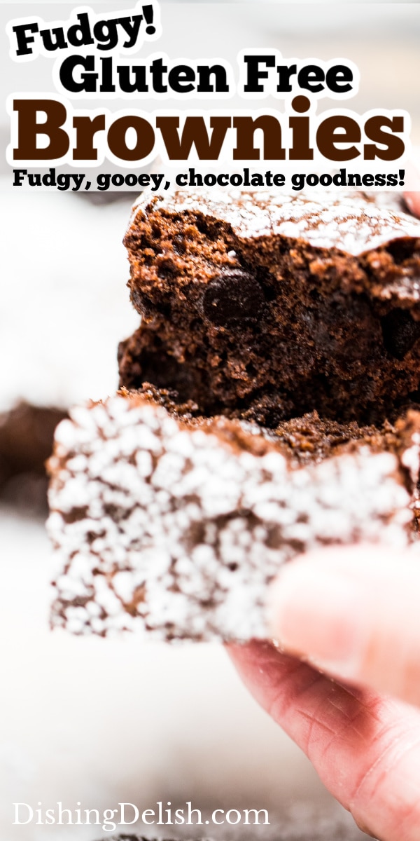 Pinterest pin with a photo of two hands breaking a brownie in half.