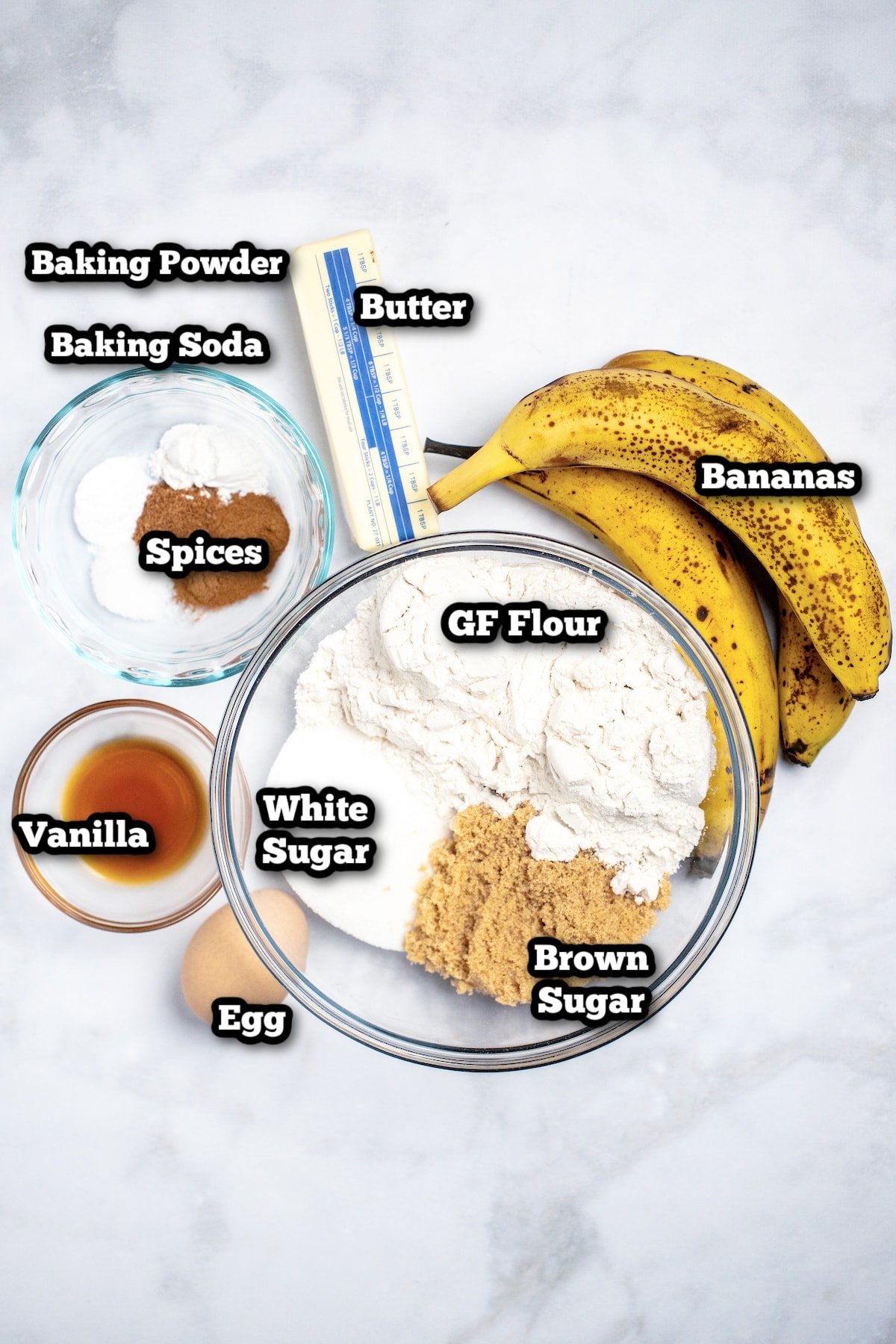 Individual ingredients for banana bread on a table.