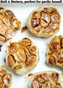 pinterest pin with oven roasted garlic cloves in a baking dish.