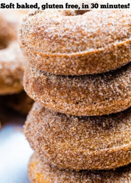 Pinterest pin with four doughnuts coated in cinnamon sugar stacked on top of each other.