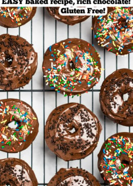 Pinterest pin of a cooling rack full of chocolate donuts with chocolate and rainbow sprinkles.