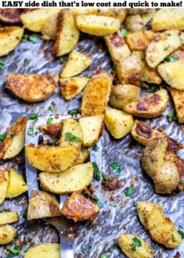 Pinterest pin with a spatula on a sheet pan of garlic parmesan roasted potatoes.