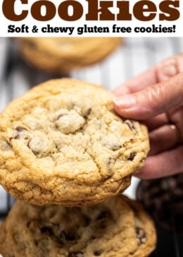Pinterest pin of a hand holding a large chocolate chip cookie.