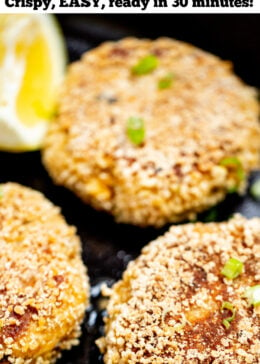 Pinterest pin with photo of gluten free crab cakes in a skillet.