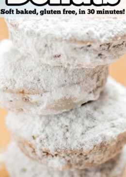 Pinterest pin with four powdered sugar donuts stacked on top of each other.