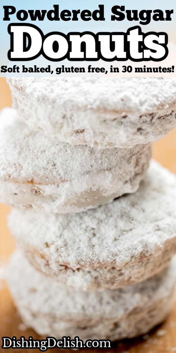 Pinterest pin with four powdered sugar donuts stacked on top of each other.