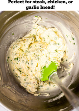 Pinterest pin with garlic herb butter in a mixing bowl with a spatula.