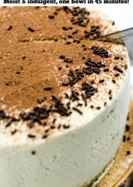 Pinterest pin of chocolate coffee cake with mascarpone frosting decorated on top with chocolate sprinkles and dusted with cocoa powder. A knife is cutting into the cake.