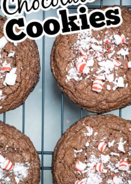 A pinterest pin of a batch of peppermint chocolate cookies cooling on a rack.