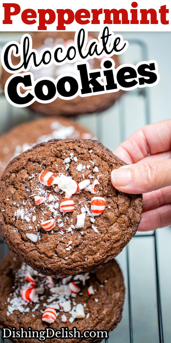 Pinterest pin of a hand holding a peppermint chocolate cookie above other cookings cooling on a rack.