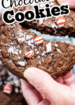 A pinterest pin with two hands breaking a peppermint chocolate cookie in half.