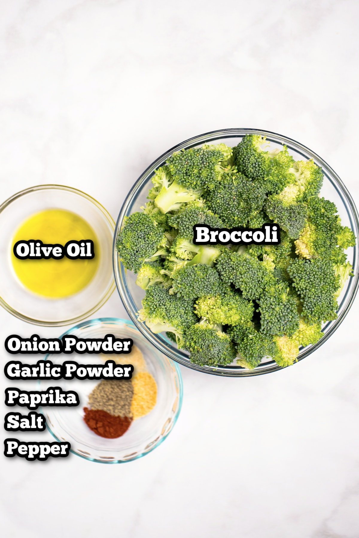 Pinterest pin with individual ingredients for air fryer broccoli on a table.