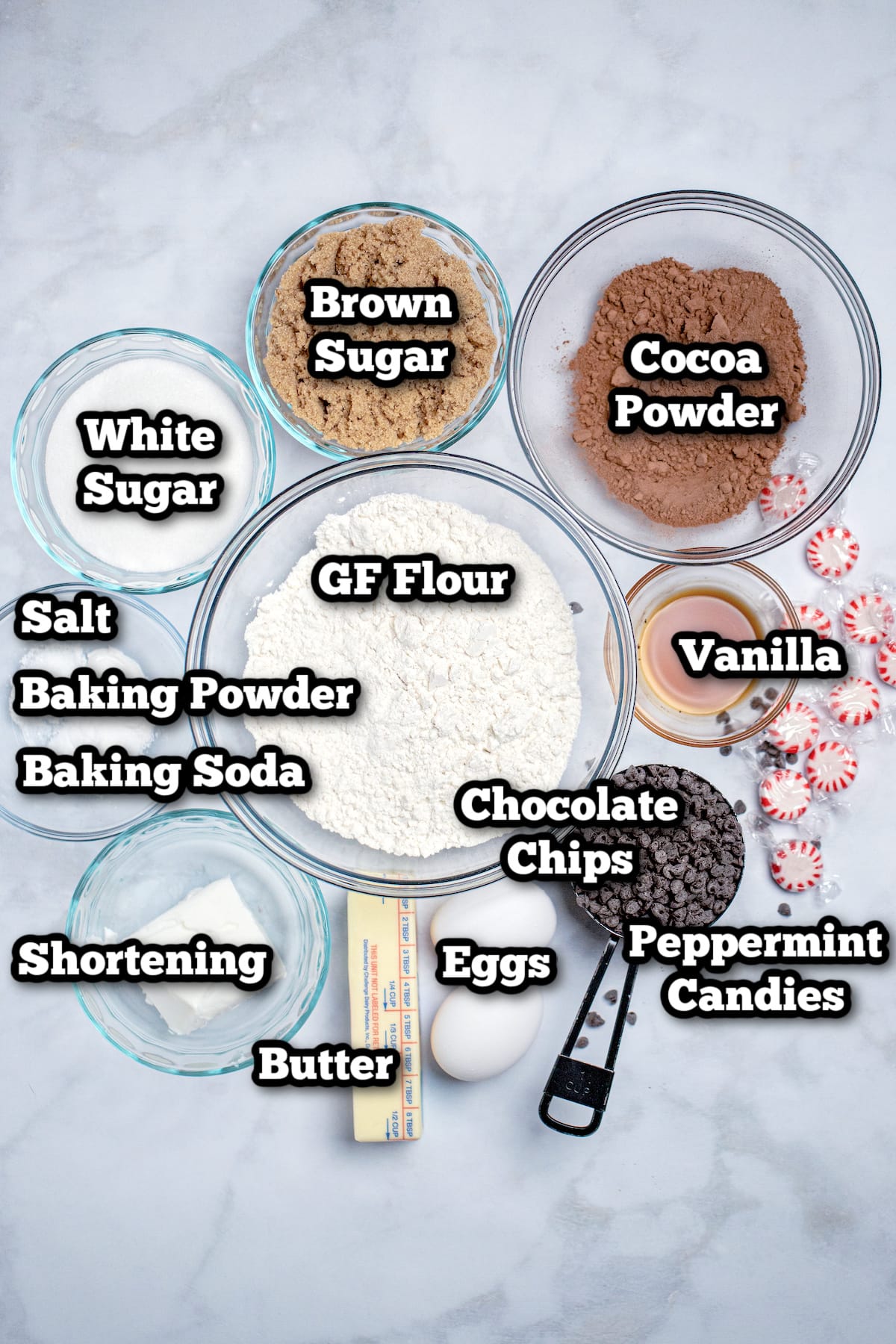 Individual ingredients for peppermint chocolate cookies on a table.