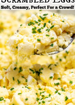 Pinterest pin with a spoon lifting baked scrambled eggs out of a baking dish topped with chives.