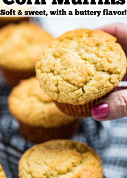 Pinterest pin with a hand holding a corn muffin above other corn muffins.