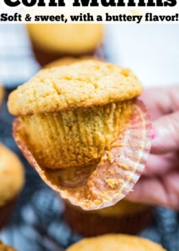 Pinterest pin with a hand holding a corn muffin with the wrapper half off.