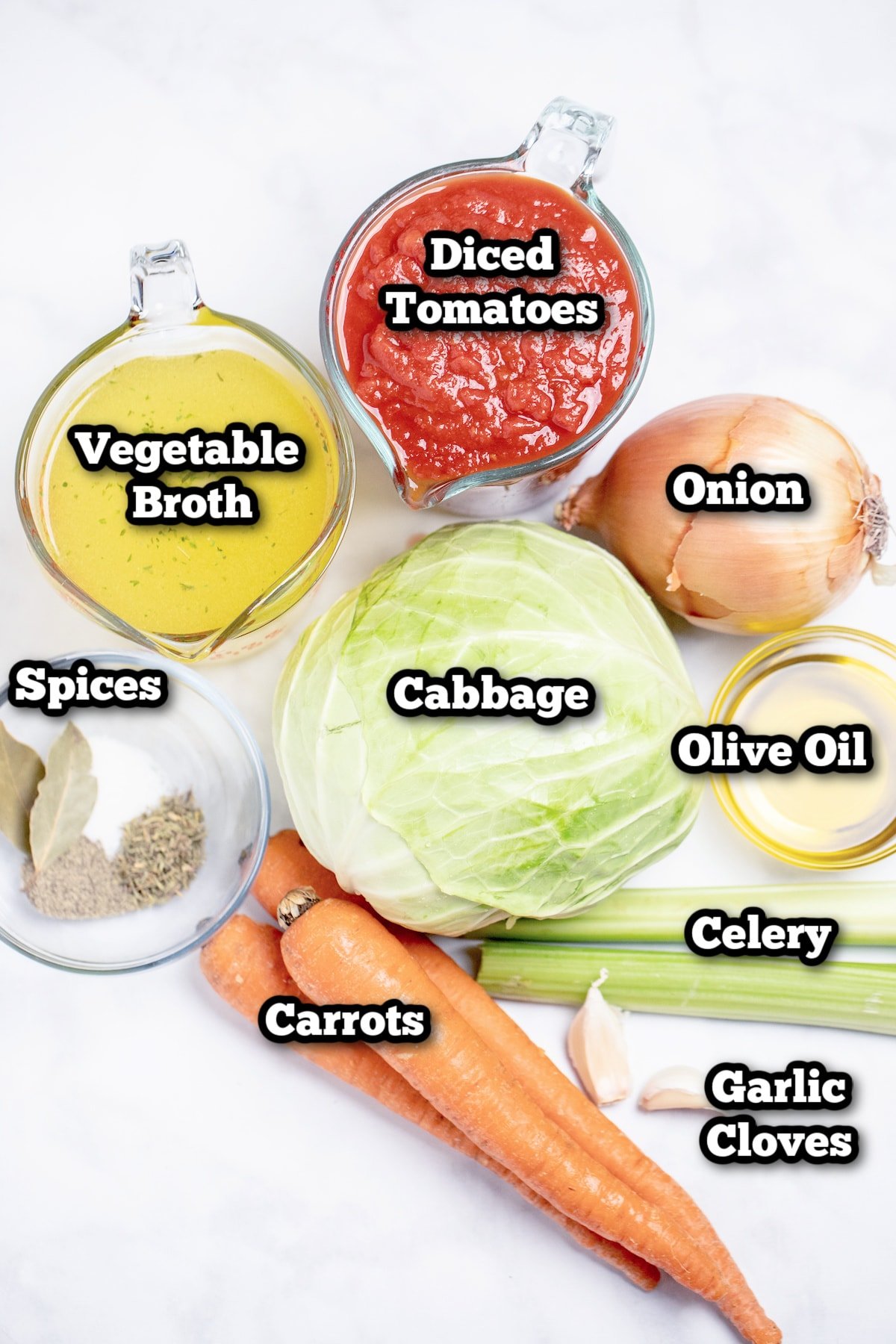 Individual ingredients for instant pot cabbage soup on a table.