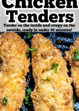 Pinterest pin with three air fryer chicken tender pieces sitting in the air fryer basket topped with green onions.