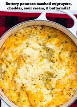 Pinterest pin with a dutch oven of cheesy mashed potatoes that's already been served from.