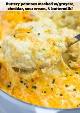 Pinterest pin with a spoon scooping cheesy mashed potatoes, with melty cheese pulling from the dish.