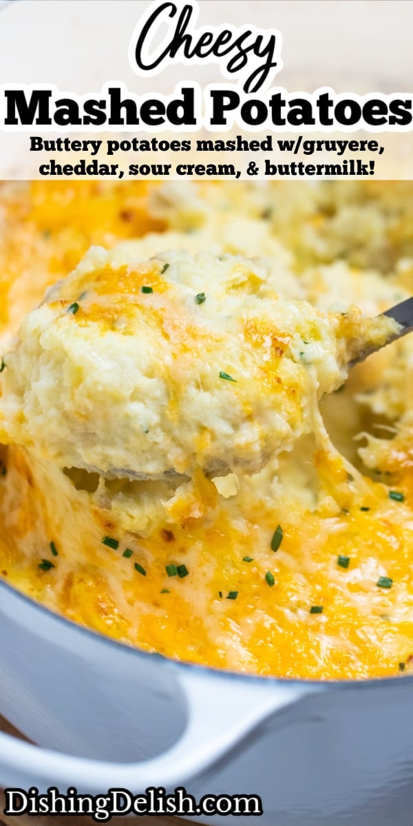 Pinterest pin with a spoon scooping cheesy mashed potatoes, with melty cheese pulling from the dish.